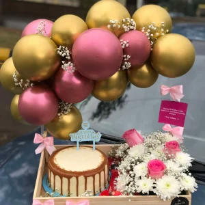 Cute wooden tray with balloon arch, cake, flowers, and chocolates by The LuvBox PK – gift shop in Islamabad
