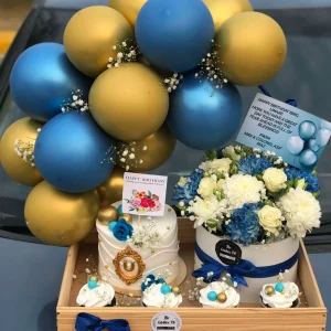 Wooden tray with blue balloon arch, cake, cupcakes, flowers, chocolates – birthday gift for him by The LuvBox PK