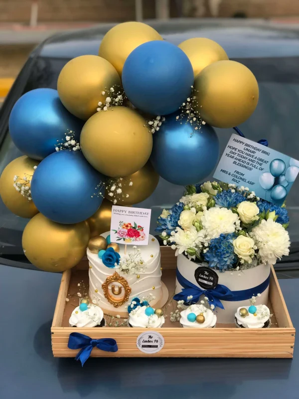 Wooden tray with blue balloon arch, cake, cupcakes, flowers, chocolates – birthday gift for him by The LuvBox PK