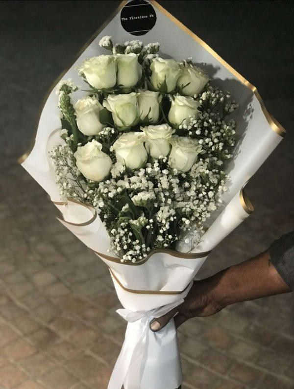 Elegant white rose bouquet wrapped beautifully for him – The LuvBox Pk Islamabad.