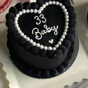 Elegant black heart fondant cake for birthdays and anniversaries – cake delivery in Islamabad.