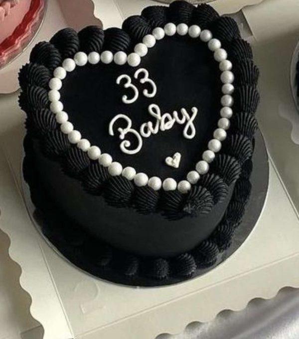 Elegant black heart fondant cake for birthdays and anniversaries – cake delivery in Islamabad.