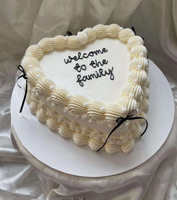 Elegant white heart-shaped fondant cake – perfect for birthday, anniversary or welcome gift in Islamabad.