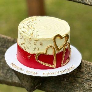 Red and white fondant heart cake – romantic anniversary cake in Islamabad.