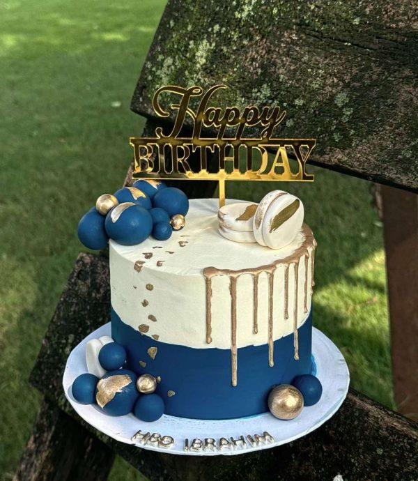 Blue and white fondant birthday cake for him – luxury customized cake in Islamabad.