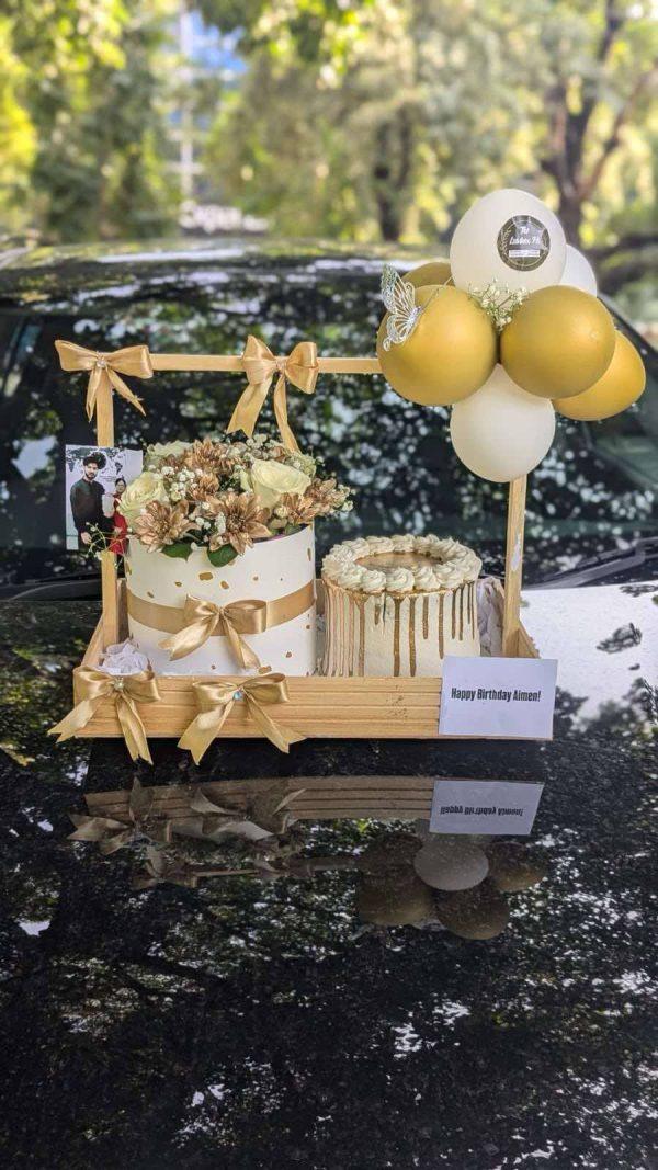 Golden wooden gift basket with cake, flower box and balloon by The LuvBox PK – gift shop in Islamabad