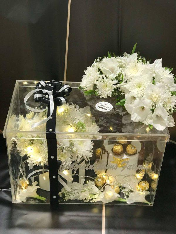 Graduation acrylic box with cake, flowers, and Ferrero Rocher by The LuvBox PK – perfect gift box from gift shop in Islamabad