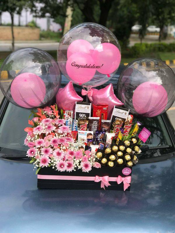 Ultimate luxury flower box with custom message balloons, premium chocolates and fresh flowers by The LuvBox PK