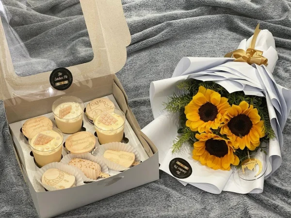 Eid/Hajj Mubarak sweet platter with cake slices, cupcakes, dessert shots, and mini sunflower bouquet – The LuvBox PK